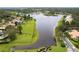 Aerial view of the lake and the large backyard of this home at 131 Wimbledon Cir, Lake Mary, FL 32746