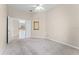 Bedroom showcasing a doorway, closet with sliding doors, and a window filling the room with light at 131 Wimbledon Cir, Lake Mary, FL 32746