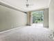 Spacious bedroom featuring neutral walls, carpet flooring, and sliding glass doors to the lanai at 131 Wimbledon Cir, Lake Mary, FL 32746