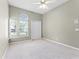Airy bedroom with natural light and ceiling fan featuring a large closet with sliding doors at 131 Wimbledon Cir, Lake Mary, FL 32746