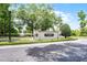 Willowbrook Village sign with lush landscaping, manicured bushes and a beautiful fountain in the background at 131 Wimbledon Cir, Lake Mary, FL 32746
