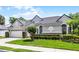 Attractive single-story home with a well-maintained lawn and tasteful landscaping at 131 Wimbledon Cir, Lake Mary, FL 32746