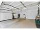 Spacious garage with ample storage cabinets and a utility sink at 131 Wimbledon Cir, Lake Mary, FL 32746