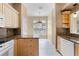Eat-in kitchen featuring granite countertops, natural wood cabinetry, and stainless steel appliances at 131 Wimbledon Cir, Lake Mary, FL 32746