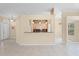 Kitchen pass-through with bar seating and views to the living room and dining area at 131 Wimbledon Cir, Lake Mary, FL 32746