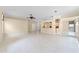 Spacious living room featuring tile flooring, neutral walls, and ample natural light at 131 Wimbledon Cir, Lake Mary, FL 32746