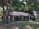 A large covered pavilion with picnic tables and bbq grills for community gatherings and outdoor enjoyment at 131 Wimbledon Cir, Lake Mary, FL 32746