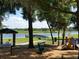 Playground with a waterfront picnic area, dock, and benches offering scenic views of the lake at 131 Wimbledon Cir, Lake Mary, FL 32746
