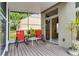 Cozy covered screened patio with seating, ideal for enjoying the outdoors at 131 Wimbledon Cir, Lake Mary, FL 32746