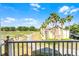 Gorgeous golf course views from the balcony featuring lush greenery and clear skies at 1322 Seven Eagles Ct # 301, Reunion, FL 34747
