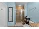 Lovely bathroom featuring a tile shower and a large mirror; ideal for relaxation at 1322 Seven Eagles Ct # 301, Reunion, FL 34747