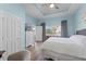 Light and airy bedroom featuring hardwood floors, a tray ceiling and plenty of natural light at 1322 Seven Eagles Ct # 301, Reunion, FL 34747