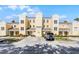 Charming building exterior with well-maintained landscaping and convenient parking at 1322 Seven Eagles Ct # 301, Reunion, FL 34747