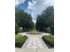 Picturesque garden and fountain area with trees and walkways, perfect for a stroll at 1322 Seven Eagles Ct # 301, Reunion, FL 34747