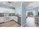 Well-equipped kitchen open to a spacious living area, featuring granite countertops and appliances at 1322 Seven Eagles Ct # 301, Reunion, FL 34747