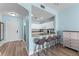 Modern kitchen with granite countertops and bar stool seating open to living area at 1322 Seven Eagles Ct # 301, Reunion, FL 34747