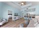 Inviting living room with kitchen view, stylish decor, and wood-look flooring at 1322 Seven Eagles Ct # 301, Reunion, FL 34747