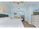 Inviting main bedroom with tub, adjacent bathroom, and wood-look flooring at 1322 Seven Eagles Ct # 301, Reunion, FL 34747