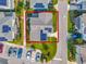 Aerial view of a property with solar panels and manicured lawn outlined in red at 13241 Cormack Ln, Orlando, FL 32827