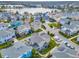 Aerial view showcases the community's home exteriors and a lake at 13241 Cormack Ln, Orlando, FL 32827