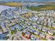 Aerial view of the neighborhood showcasing the community's layout, homes, and surrounding landscape with a lake nearby at 13241 Cormack Ln, Orlando, FL 32827