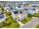 Aerial view of a two-story home with solar panels, showcasing the well-maintained landscaping and neighborhood at 13241 Cormack Ln, Orlando, FL 32827