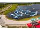 Aerial view of a community featuring a lake with a water obstacle course at 13241 Cormack Ln, Orlando, FL 32827