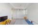 Bright bedroom featuring modern sliding closet doors, plush carpeting, and contemporary decor elements that emphasize simplicity at 13241 Cormack Ln, Orlando, FL 32827