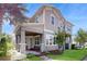 Charming two-story home with a covered front porch and beautifully landscaped yard at 13241 Cormack Ln, Orlando, FL 32827