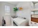 Efficient laundry room with modern washer, dryer, and storage offers convenience and functionality for everyday chores at 13241 Cormack Ln, Orlando, FL 32827