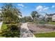 Community playground with modern climbing structures, seating, and landscaping at 13241 Cormack Ln, Orlando, FL 32827