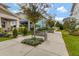 Inviting neighborhood street view with benches, landscaping, and colorful homes at 13241 Cormack Ln, Orlando, FL 32827
