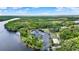 Picturesque marina on the water with lush green landscape offers boating and a community with nearby pool at 133 Moss Dr, Debary, FL 32713