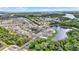 An aerial view reveals community by the lake, surrounded by picturesque scenery and green spaces at 133 Moss Dr, Debary, FL 32713