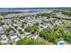 Expansive community near a lake with homes nestled among lush greenery, offering a serene and picturesque setting at 133 Moss Dr, Debary, FL 32713