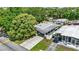 Aerial view of the home, with a long drive way and a carport at 133 Moss Dr, Debary, FL 32713