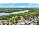 Lush green space with mature trees and a tranquil river surrounds a welcoming community with RV parking at 133 Moss Dr, Debary, FL 32713
