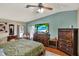 Comfortable bedroom with ample storage, a ceiling fan, and a mounted TV at 133 Moss Dr, Debary, FL 32713