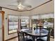 Sunlit breakfast nook with a round table and large windows offering neighborhood views at 133 Moss Dr, Debary, FL 32713