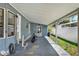 Spacious carport offering covered parking and protection from the elements with lighting at 133 Moss Dr, Debary, FL 32713