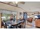 Open dining area with an oval table, seamlessly connected to the adjacent living room at 133 Moss Dr, Debary, FL 32713