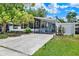 Inviting home with a well-manicured lawn, long driveway, and charming landscaping enhancing curb appeal at 133 Moss Dr, Debary, FL 32713