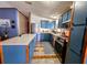 Traditional style kitchen features blue cabinets, stainless steel appliances, and lots of counter space at 133 Moss Dr, Debary, FL 32713