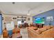 Comfortable living room with leather couches, ceiling fan, and a wall-mounted flat screen television at 133 Moss Dr, Debary, FL 32713