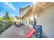 Home's backyard featuring a brick patio area, play set, and manicured landscaping at 13618 Briand Ave, Orlando, FL 32827