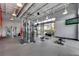 Fitness center equipped with weights, cable machines and large windows for natural light at 13618 Briand Ave, Orlando, FL 32827