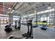 Community gym with treadmills, elliptical machines, and large windows with ample natural light at 13618 Briand Ave, Orlando, FL 32827