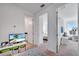 Hallway with multiple rooms and a TV to provide entertainment and a cozy atmosphere at 13618 Briand Ave, Orlando, FL 32827