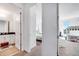 Bright hallway with views of a bedroom, bathroom with modern white vanity, and playroom at 13618 Briand Ave, Orlando, FL 32827