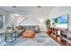 Comfortable living room featuring hardwood floors, a cozy couch, and a bright sunny window at 13618 Briand Ave, Orlando, FL 32827